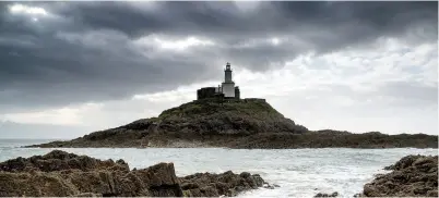  ?? ?? The lighthouse at Mumbles, the gateway to the Gower Peninsula, one of the author’s 327 ports of call