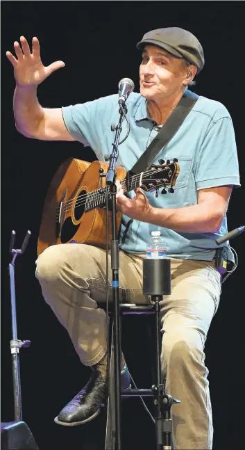  ?? RICHARD SHOTWELL — ASSOCIATED PRESS ARCHIVES ?? James Taylor performs a benefit concert in Los Angeles in 2016. At 69, the venerated singer-songwriter says he still spends half the year touring.