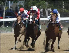  ?? ELSA LORIEUL/NYRA ?? By Your Side (center) with Irad Ortiz, Jr. up leads Raging Whiskey (right) and Cucina (left) around the far turn and head for home and capture the Grade 3 Sanford Stakes at Saratoga Race Course.