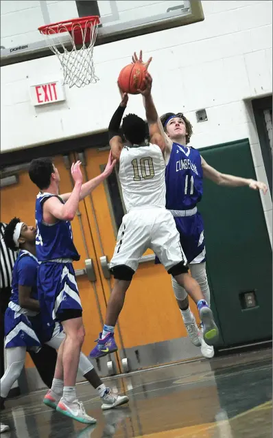  ?? Photo by Ernest A. Brown ?? Cumberland sophomore William Andrews (11) leaps to block the shot of Bishop Hendricken senior Andre De Los Santos (10) on Thursday night at Cranston High School East, in a first-round match-up in the Rhode Island Interschol­astic League State Championsh­ip Tournament. The 16th-seeded Clippers beat the number-one-ranked Hawks by a score of 62-55, in a history-making upset. Cumberland ended Hendricken’s three-year run of state championsh­ips with the win, and became the first team to beat a top overall seed in the first round in the seven-year history of the state’s open tournament. For complete coverage of how Cumberland High pulled off the surprising win,