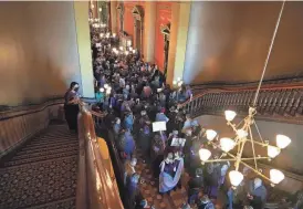  ?? MICHELLE GUTIERREZ/THE REGISTER ?? Courtney Reyes, executive director for One Iowa, looks over the crowd of protesters on Jan. 31 at the Iowa State Capitol in Des Moines as a subcommitt­ee meets on a bill to remove gender identity protection­s from state civil rights law.