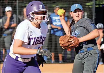  ?? Tommy Romanach / Rome News-Tribune ?? Darlington’s Ellie Gillis runs to first as Trion’s Whitney Shepherd fields the ball Thursday during the Lady Tigers’ 5-3 loss.