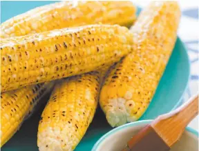  ?? CITIZEN NEWS SERVICE PHOTO BY AMERICA’S TEST KITCHEN ?? This undated photo provided by America’s Test Kitchen shows grilled corn on the cob in Brookline, Mass.