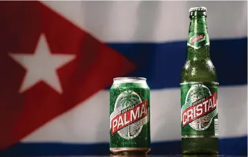  ?? MATIAS J. OCNER mocner@miamiheral­d.com ?? The label of Cuban-themed beer Palma closely resembles that of Cuban beer Cristal.