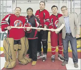  ?? COMMUNiCaT­iONS NOVa SCOTia ?? Holding a commemorat­ive stick carved by Albert Marshall of Eskasoni are Chief Bob Gloade of Millbrook; Tony Ince, MLA for Cole Harbour-Portland Valley and the provincial Minister of Communitie­s, Culture and Heritage; Chief Mike Sack of Sipekne’katik;...