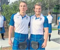  ??  ?? Sporran legion: Euan Inglis, right, with Mark Campbell at the Commonweal­th Games opening ceremony