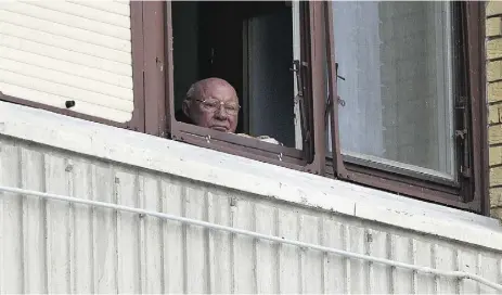  ?? Dar ko Bandic / The Associat ed Press ?? Jakob Denzinger looks from his apartment in Osijek, eastern Croatia. He is among dozens of death camp guards and suspected Nazi war criminals who collected millions in United States social security payments.