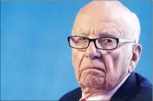  ?? JASON REED/AFP ?? Rupert Murdoch listens during a panel discussion at the B20 meeting of company CEOs in Sydney on July 17, 2014.