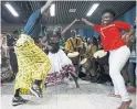  ?? COLE BURSTON FOR THE TORONTO STAR ?? An Emancipati­on Day celebratio­n at Downsview Station in 2017. The date honours the Abolition of Slavery Act, which set free more than 800,000 people of African descent throughout the British Empire.