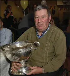  ??  ?? Donald Murphy in the company of the All Ireland Minor Football Cup at the Castlemagn­er GAA function.