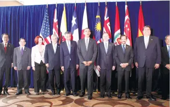  ?? AP FOTO/ CHARLES DHARAPAK ?? STILL OPTIMISTIC. This photo taken on Nov. 14, 2010 shows leaders of 12 nations who attended the Trans-Pacific Partnershi­p meeting at the APEC Summit in Yokohama, Japan. Other leaders hope to salvage the TPP after US President Donald Trump decided to...