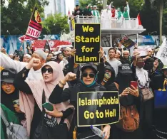  ?? (Willy Kurniawan/Reuters) ?? INDONESIAN MUSLIMS protest after a far-right politician publicly set fire to the Koran in Sweden, outside the Swedish Embassy in Indonesia yesterday.