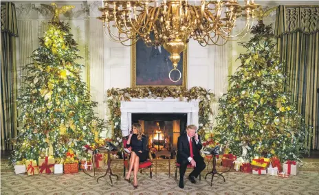  ?? EPA ?? US President Donald Trump and first lady Melania speak to children calling Norad at the White House on Christmas Eve