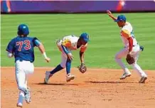  ?? PRENSA MUNDIAL SUB-23 ?? A nivel de mayores, el béisbol de Colombia ganó los dos primeros títulos mundiales del país, en 1947 y 1965.