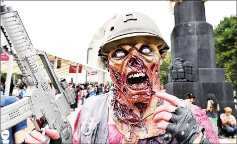  ??  ?? People take part in the annual ‘Zombie Walk’ at the Revolution Square in Mexico City on Oct 22. (AFP)