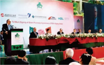  ??  ?? January 20, 2017: Pakistani Finance Minister Ishaq Dar (left) delivers a speech at the ceremony marking the signing of a share purchase agreement of the equity stake of the Pakistan Stock Exchange (PSX) in Karachi. Three Chinese financial organizati­ons...