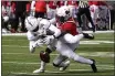  ?? RICK SCUTERI — THE ASSOCIATED PRESS ?? Ball State cornerback Antonio Phillips defends the pass intended for San Jose State wide receiver Jermaine Braddock (13) in the first half of the Arizona Bowl on Thursday in Tucson, Ariz.