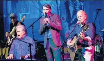  ?? Kevin Winter
Getty Images ?? BRIAN WILSON, left, actor Paul Dano, who played Wlilson in “Love & Mercy,” and Al Jardine at Vibrato.