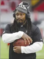  ?? The Associated Press ?? Oakland Raiders running back Marshawn Lynch walks along the sidelines prior to an NFL preseason game against the Arizona Cardinals last Saturday in Glendale, Ariz.