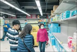  ?? Billy H.C. Kwok Getty Images ?? TAIWAN’S RUN on toilet paper started Feb. 23, when local media reported that prices would go up and showed scenes of depleted shelves and worried shoppers.