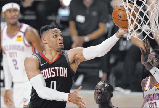  ?? Mark J. Terrill The Associated Press ?? Russell Westbrook on being dealt to Washington: “Happy about where I’m at and understand­ing that this is a new journey for me.”