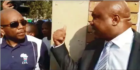  ??  ?? NOT WELCOME: DA leader Mmusi Maimane was embroiled in a heated argument with Deputy Police Minister Bongani Mkongi’s Chief of Staff, Jabu Mfusi, while leading a march to Nyanga police station yesterday.