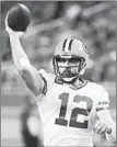  ?? RICK OSENTOSKI/AP ?? Packers QB Aaron Rodgers sports a 9-7 playoff record while passing for 36 TDs in his career.