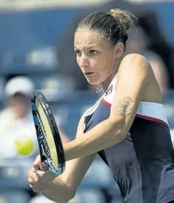  ?? NATHAN DENETTE/THE CANADIAN PRESS ?? Karolina Pliskova of the Czech Republic returns the ball against Naomi Osaka of Japan during women’s third round Rogers Cup tennis action in Toronto on Thursday. Pliskova defeated Osaka to move on to the quarter-finals.