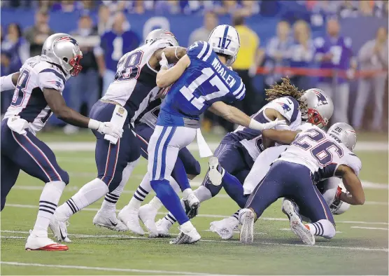  ??  ?? The Colts were giving the Patriots a good game when they handed Tom Brady and Bill Belichick the victory Sunday night with an ill- conceived fake punt attempt from their own 37.