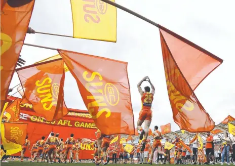  ?? Picture: AAP ?? The Gold Coast Suns, and Titans, are flying the flag for our city on the pitch. Now it’s up to the city to get behind them.