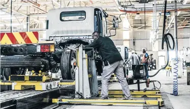  ??  ?? DRIVING AHEAD: A truck being assembled at Isuzu’s consolidat­ed truck and bakkie manufactur­ing plant in Struandale