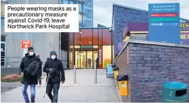 ??  ?? People wearing masks as a precaution­ary measure against Covid-19, leave Northwick Park Hospital