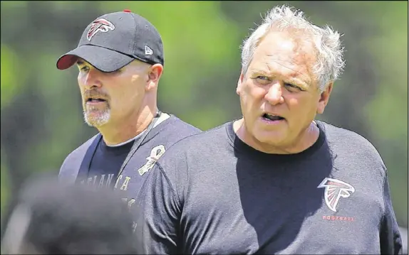  ?? CURTIS COMPTON / CCOMPTON@AJC.COM ?? Richard Smith (right) had been the Falcons’ defensive coordinato­r for the past two seasons. Dan Quinn (left), who was Seattle’s defensive coordinato­r before becoming the Falcons coach, is regarded as the architect of Atlanta’s defense.