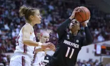  ?? Darron Cummings, The Associated Press ?? N.C. State's Jakia Brown-turner (11) shoots against Indiana's Ali Patberg (14) during Thursday’s game in Bloomingto­n, Ind.