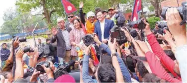  ?? Associated Press ?? ↑
Hari Budha Magar is welcomed upon arrival at the airport in Kathmandu on Tuesday.