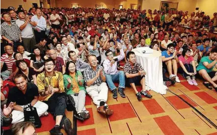  ??  ?? Full house: People watching the debate outside the forum hall at Berjaya Times Square Hotel in Kuala Lumpur yesterday.