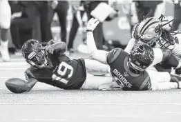  ?? Karen Warren / Staff photograph­er ?? Andre Roberts (19) lost control of the ball on a punt return against the Panthers on Thursday night, his second fumble in the past two games.