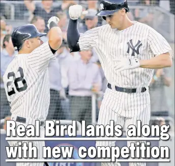  ?? AP ?? FLYING HIGH: Greg Bird (right), who went 2-for-4, celebrates with Austin Romine after hitting a solo home run in the fourth inning. Bird hit another solo shot in the eighth inning.