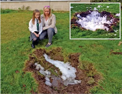  ??  ?? Impact zone: Lyndsey Helliwell and daughter Elise examine the crater left by the falling ice, inset
