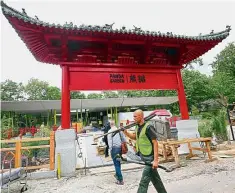  ??  ?? Constructi­on works are under way at the new panda enclosure of Berlin’s Zoologisch­er Garten zoo to prepare for the arrival of pandas Meng Meng and Jiao Qing from China. — AFP