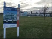  ?? RICHARD PAYERCHIN — THE MORNING JOURNAL ?? The Lorain City School board of education has approved an expanded tax deal that could help Spitzer Great Lakes Ltd. Co. build new residences in Lorain’s HarborWalk neighborho­od on the Black River. Lorain City Council will consider the deal in 2019.