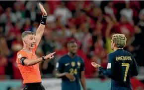  ?? AP ?? Kiwi referee Matthew Conger gestures towards France’s Antoine Griezmann after disallowin­g his goal in the match won by Tunisia