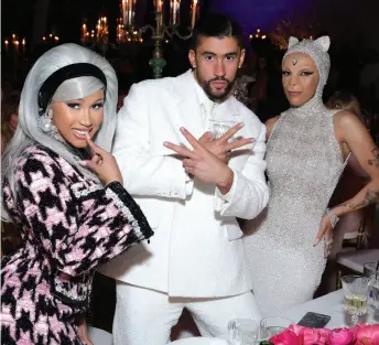  ?? ?? Cardi B (left) and Bad Bunny, who previously collaborat­ed on 2018 track “I Like It” with J Balvin, posed with Doja Cat at the 2023 Met Gala, whose theme was Karl Lagerfeld: A Line of Beauty.