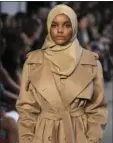  ?? BRUNO
AP PHOTO/LUCA ?? Somali-American model Halima Aden has announced that she is taking a step back from the fashion industry, saying that the pandemic slowdown has given her time to see instances when her desire to maintain a hijab was not properly respected.