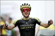  ?? CHRISTOPHE ENA — THE ASSOCIATED PRESS ?? Britain’s Simon Yates celebrates as he crosses the finish line to win the fifteenth stage of the Tour de France cycling race over 185 kilometers (114,95 miles) with start in Limoux and finish in Prat d’Albis, France, Sunday.