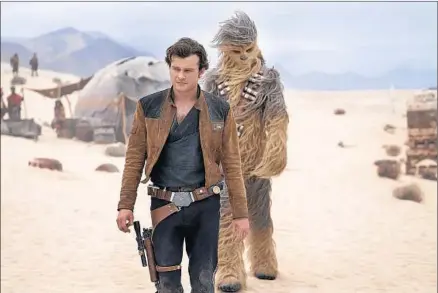  ?? Jonathan Olley Lucasfilm Ltd. ?? ALDEN EHRENREICH, foreground, and Joonas Suotamo star in “Solo: A Star Wars Story,” which had weak box-office returns.