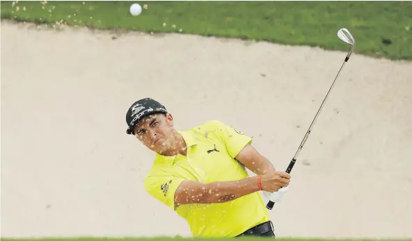  ?? — GETTY IMAGES ?? Rickie Fowler had a share of the 36-hole lead Saturday at the OHL Classic in Playa Del Carmen, Mexico, with Patrick Rodgers and Patton Kizzire also carding two-round totals of 10-under 132 during the rain-soaked tournament.