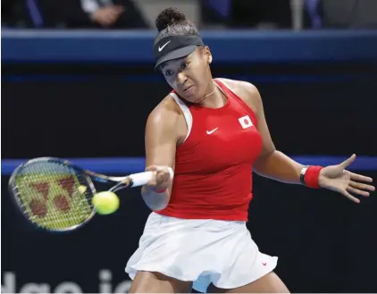  ?? ?? Naomi Osaka of Japan returns a shot against Yulia Putintseva of Kazakhstan during their Billie Jean King Cup tennis match in Tokyo, Friday, April 12, 2024. (Michi Ono/Kyodo News via AP)