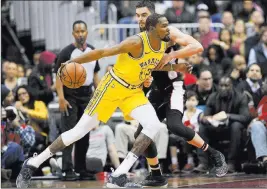  ?? Nick Wass The Associated Press ?? While Warriors forward Kevin Durant (35) had his issues with the media about his possible free-agent status, part the NBA’S off-the-court drama before Thursday’s trade deadline, teams pulled off some stunning moves to set up a wild regular-season finish.