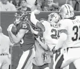  ?? Karen Warren / Houston Chronicle ?? Texans wide receiver Will Fuller (15) beats Saints cornerback P.J. Williams (25) for a 19-yard touchdown reception during the first quarter Saturday night.